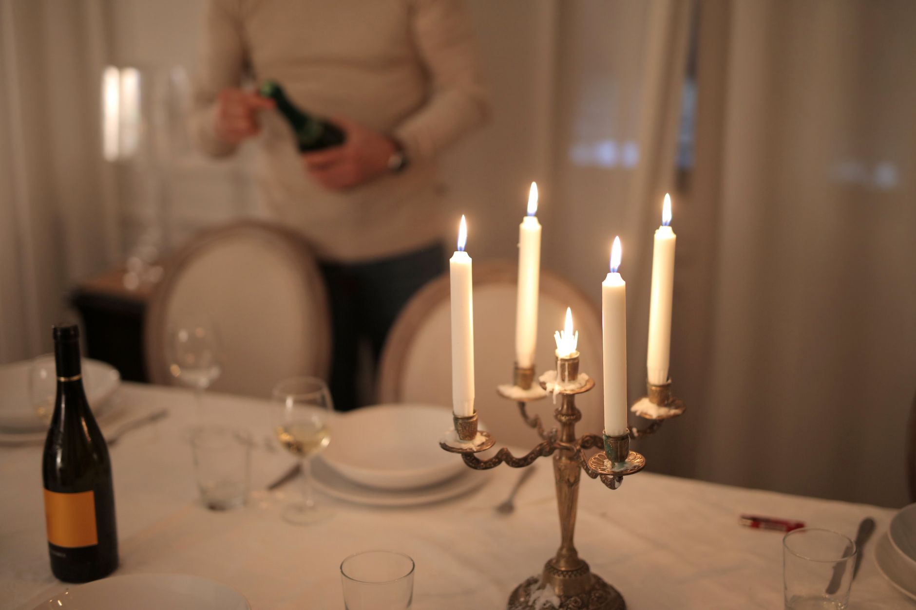 A table set with wine in warm evening glow